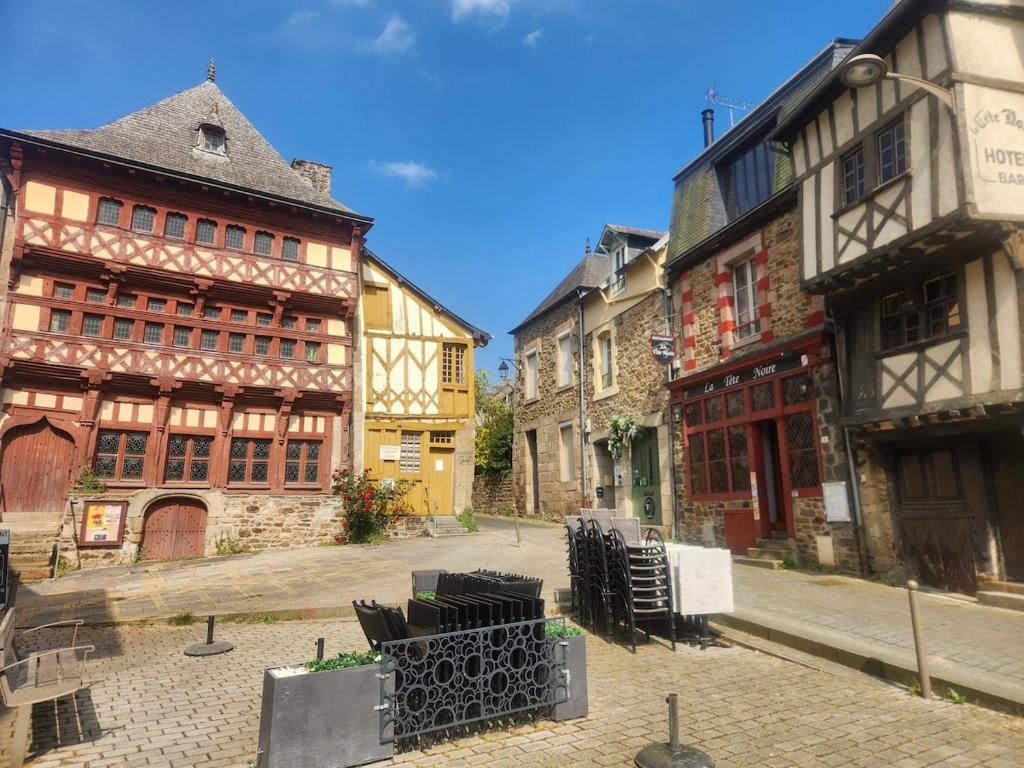 a group of buildings on a city street at Le Logis du Martray, maison historique in Lamballe Armor