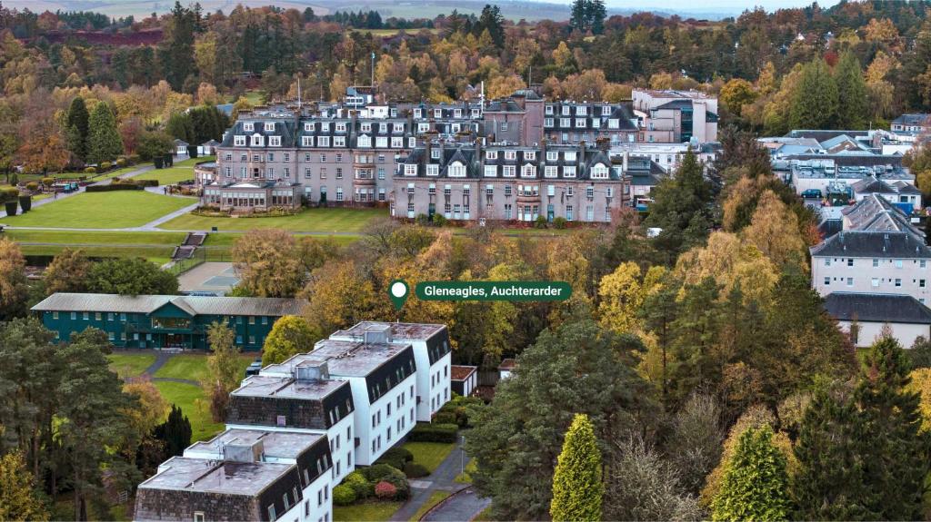 an aerial view of a town with houses and trees at Finest Retreats - Gleneagles in Auchterarder