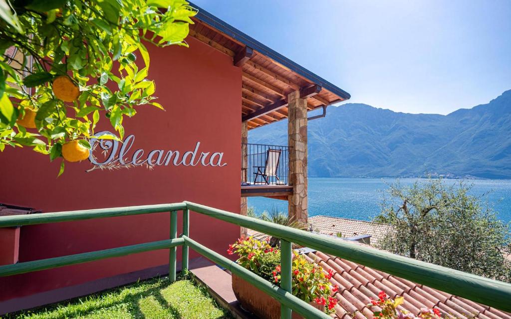 a house on the shore of a lake at Relax Hotel Villa Gardenia & Villa Oleandra in Limone sul Garda
