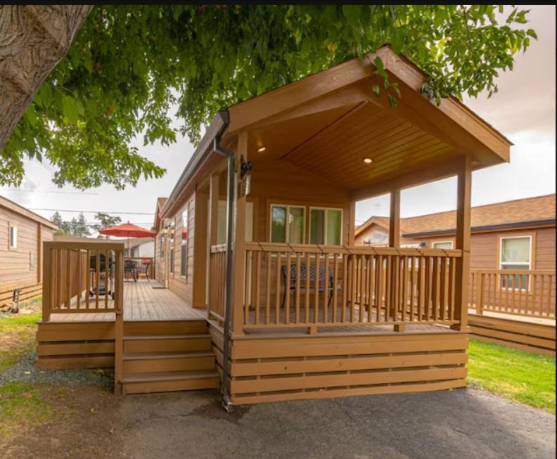 a small house with a porch and a deck at 49er Village in Plymouth