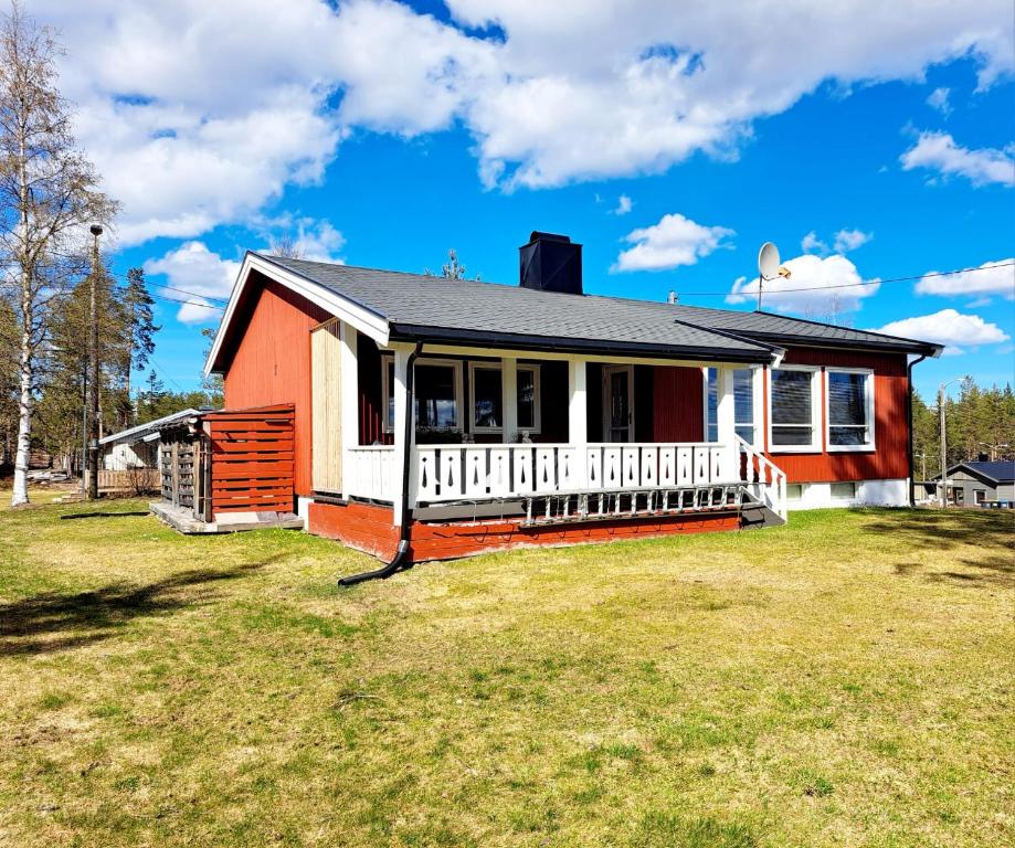 a house with a large yard in front of it at Østby Trysil luxury holiday home in Trysil