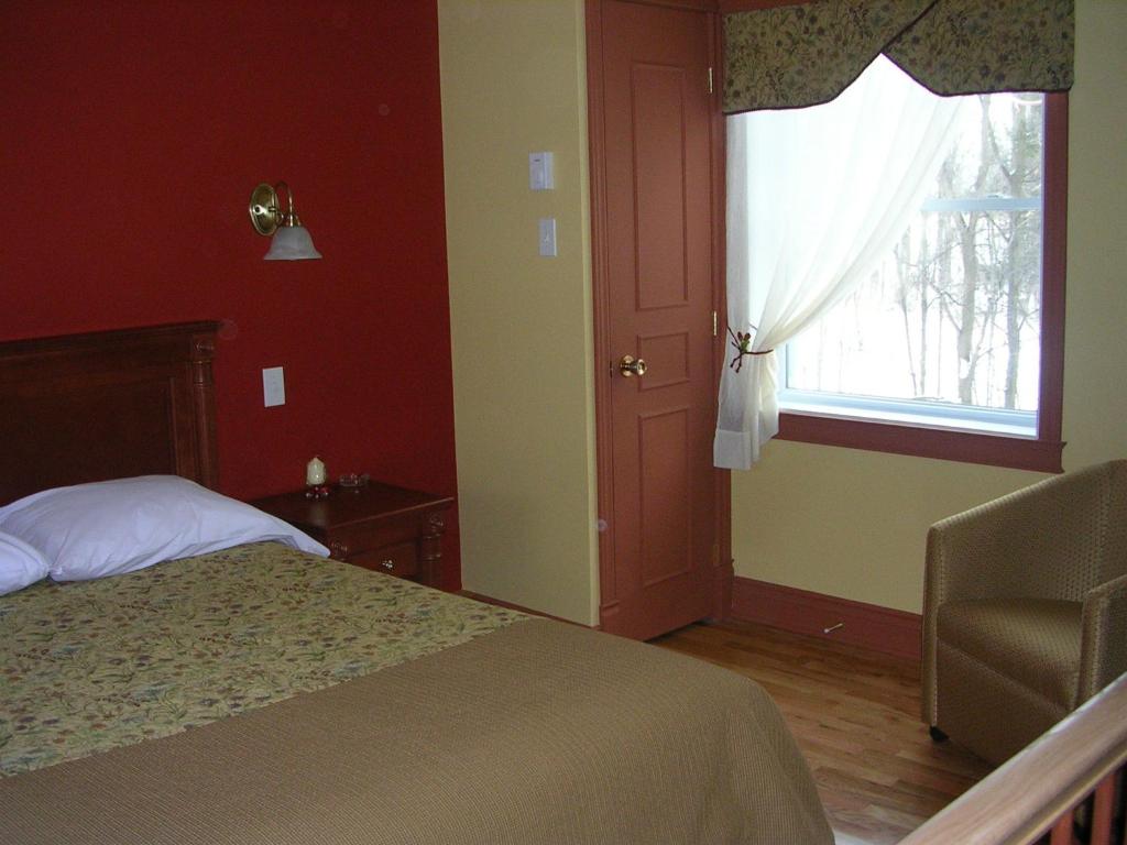 Postel nebo postele na pokoji v ubytování Motel au P'tit Sapin
