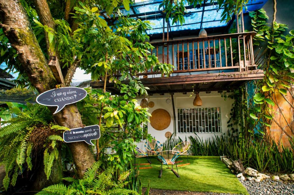 a house with signs on the side of it at Hotel Manglares in Capurganá
