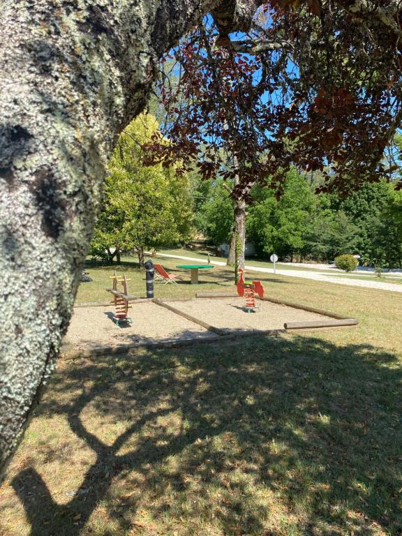 a group of children playing in a park at Insolite hobbit in Saint-André-dʼAllas