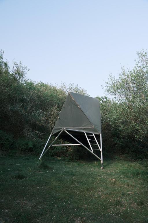 a tent sitting on the grass in a field at K-Tent 1 in Treknow
