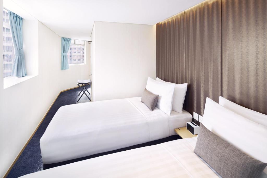 Voodi või voodid majutusasutuse Hotel 108, Hong Kong toas