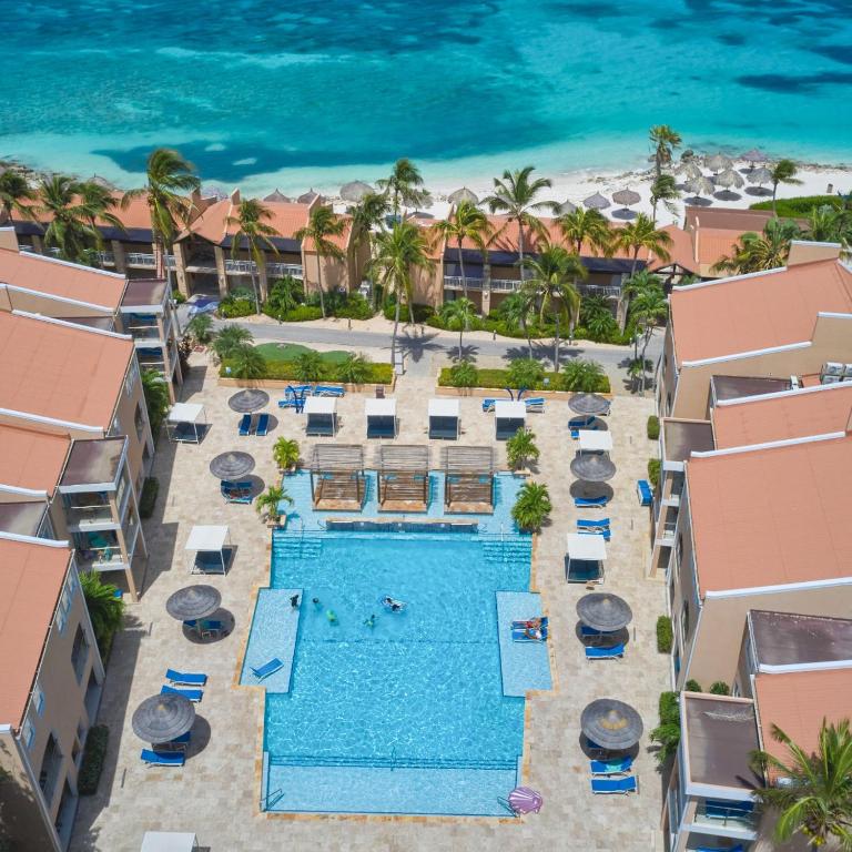 an aerial view of the resort pool and the beach at Divi Dutch Village Beach Resort in Palm-Eagle Beach