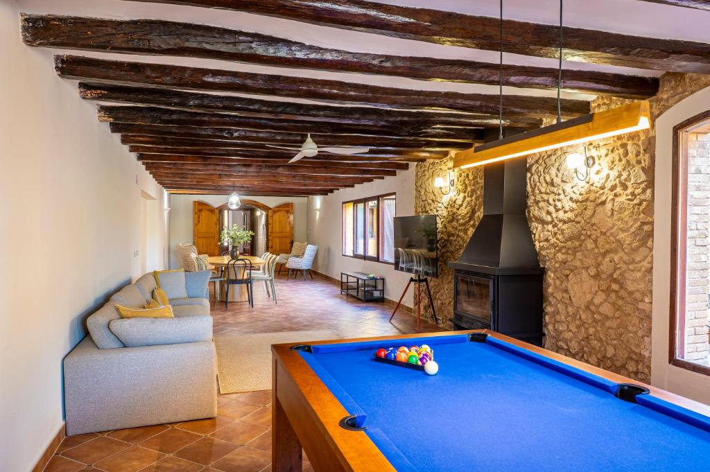 a living room with a pool table in a house at Ca L'Avi in Ca l’Avi