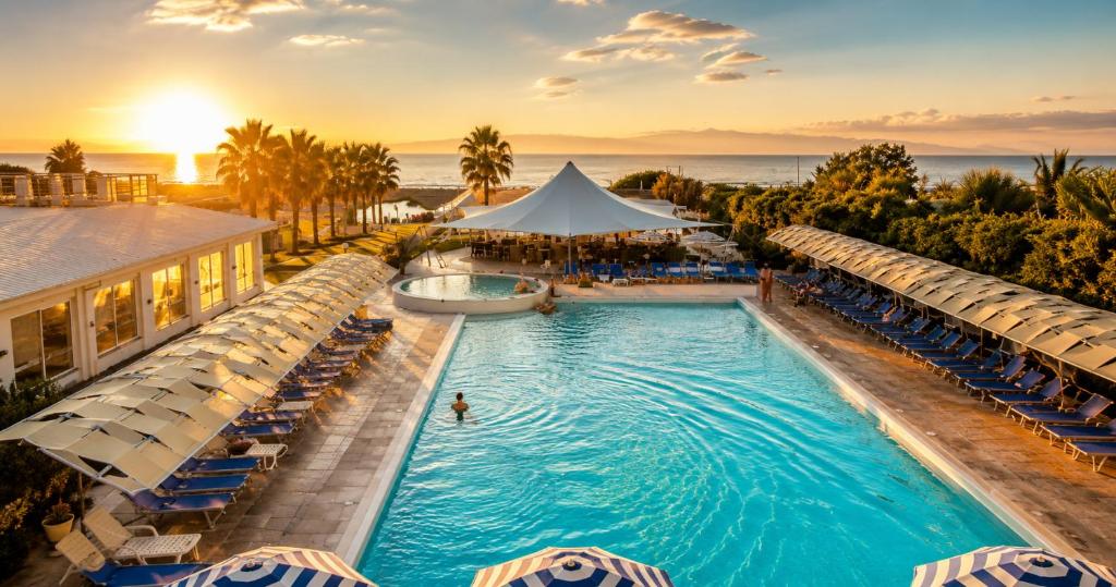 an overhead view of a pool at a resort at Medea Beach Resort - Cultural Stay near Amalfi Coast & Paestum in Paestum