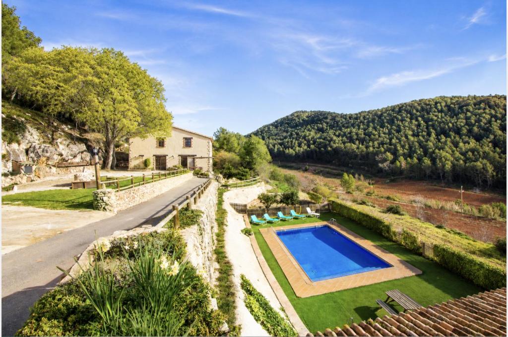 an external view of a villa with a swimming pool at Catalunya Casas Sublime seclusion in Catalonia wine Region! in Puigpelat