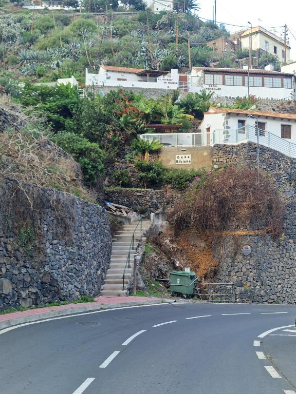 a winding road with stairs on the side of a hill at VV Casa Bibiana "by henrypole home" in Hermigua