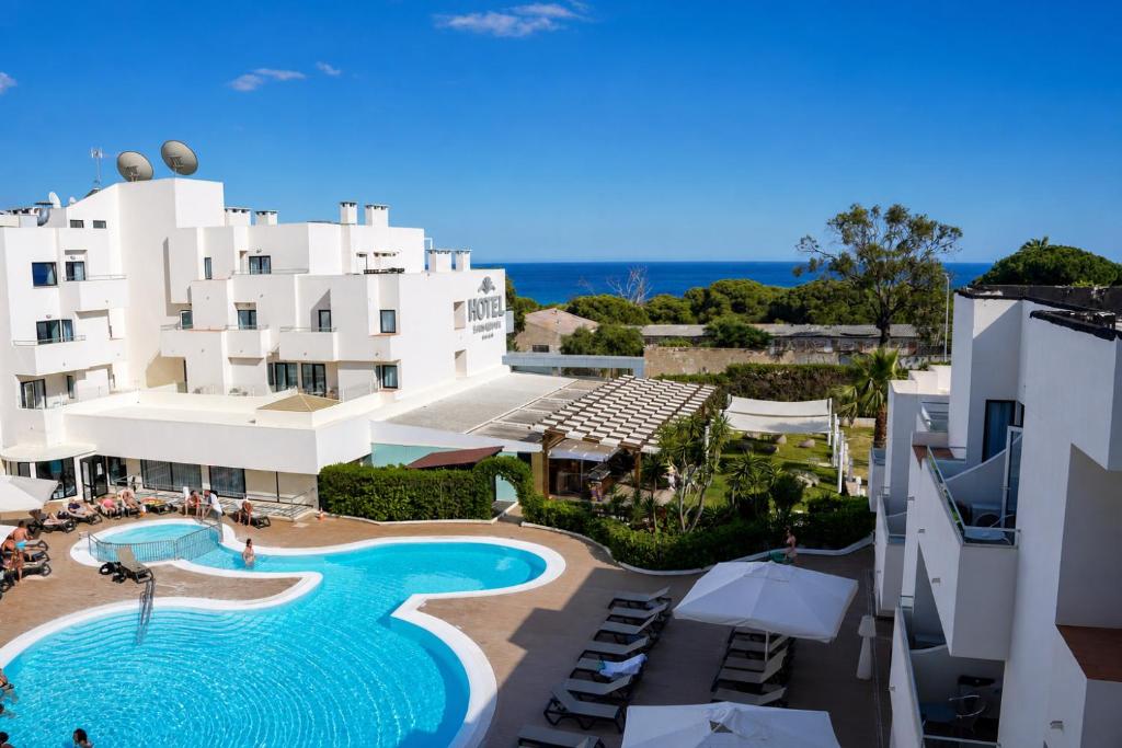 an aerial view of a hotel with a swimming pool at Santa Eulalia Hotel & Spa in Albufeira