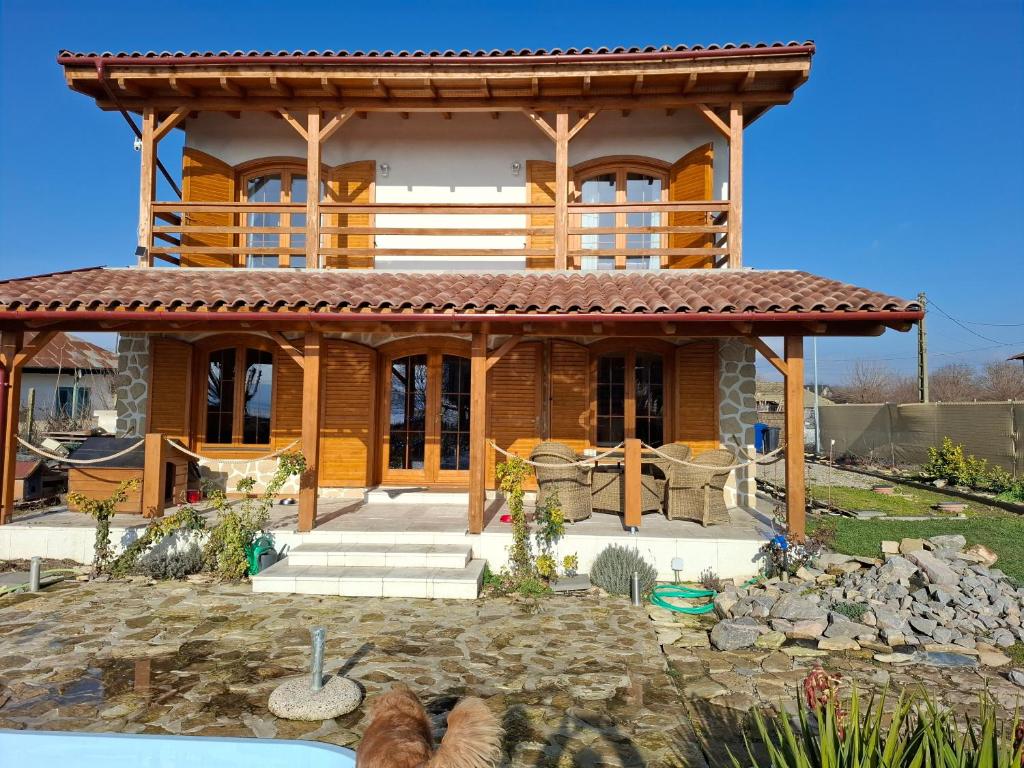 a large wooden house with a roof at ZanZebil in Zebil