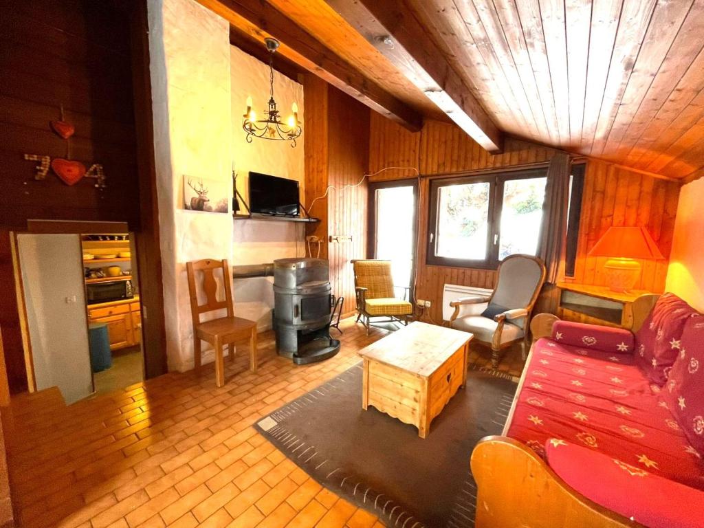 a living room with a couch and a table at Chalet Maria in Samoëns