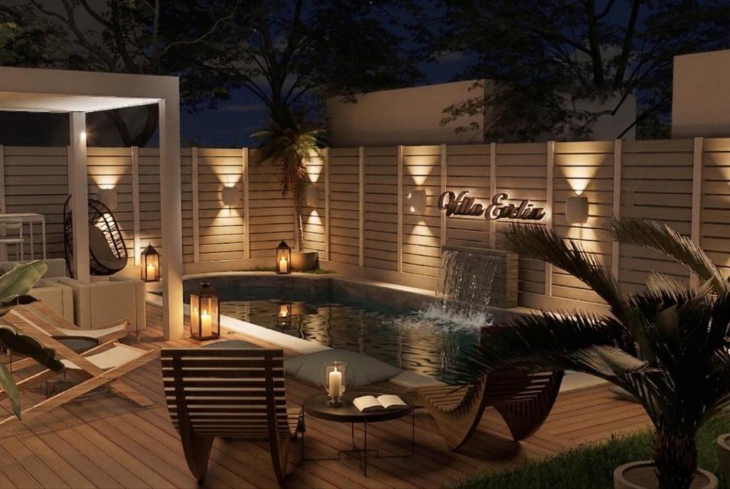 a patio with a pool and a table and chairs at Villa Evelin in Asprovalta