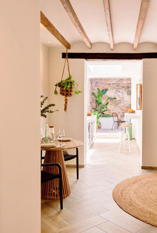 a kitchen and dining room with a table and chairs at Casa Sol in Denia