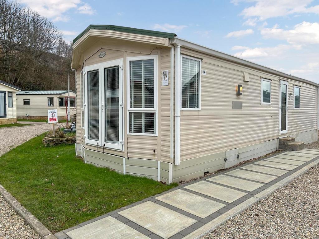 a small house is sitting on the grass at Uk51412 - The Haven in Brechin