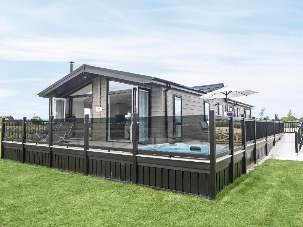 a house with a swimming pool in the yard at The Riverside Lodge - Ukc4058 in Nunthorpe