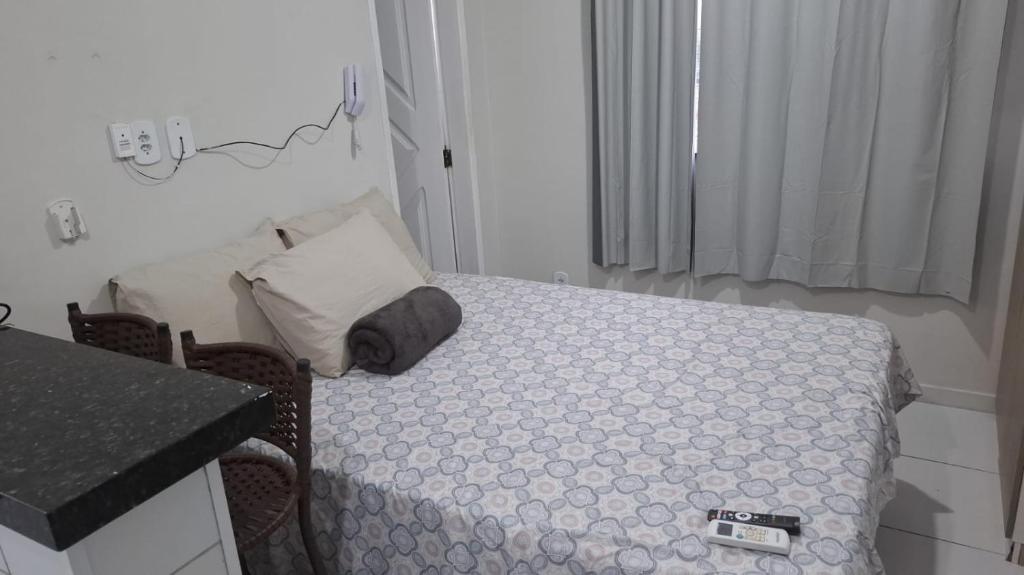 a small bedroom with a bed in a room at my sweet place 33 in São Luís