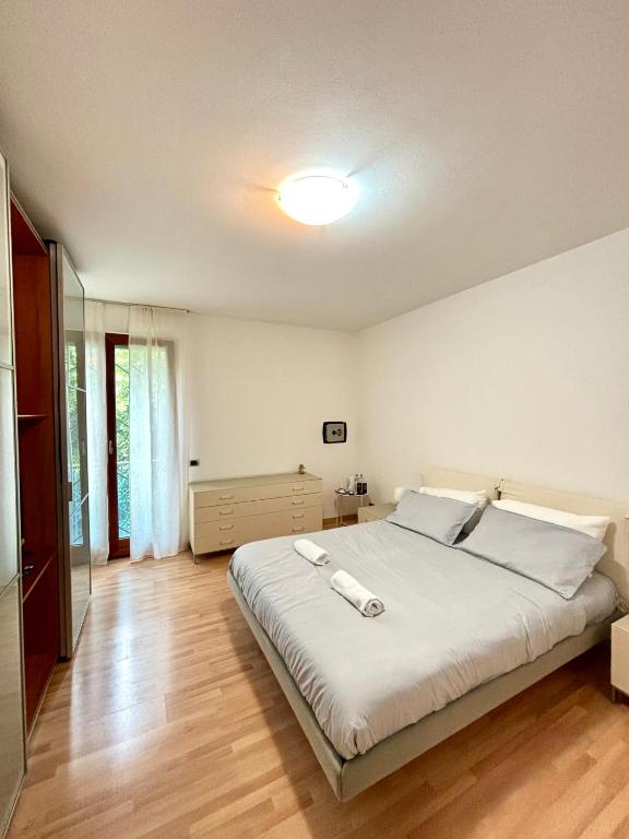 a bedroom with a large bed in a room at G&G Suites in Bugia