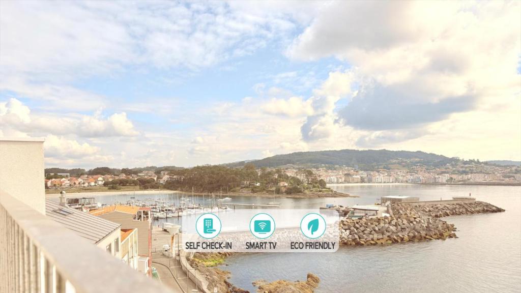 a view of a body of water with a harbor at Blue Ocean Deluxe in Sanxenxo