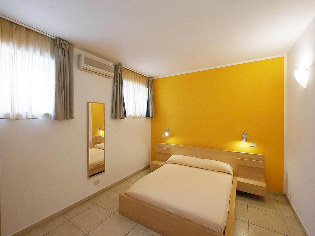 Łóżko lub łóżka w pokoju w obiekcie Residence Villa Livia