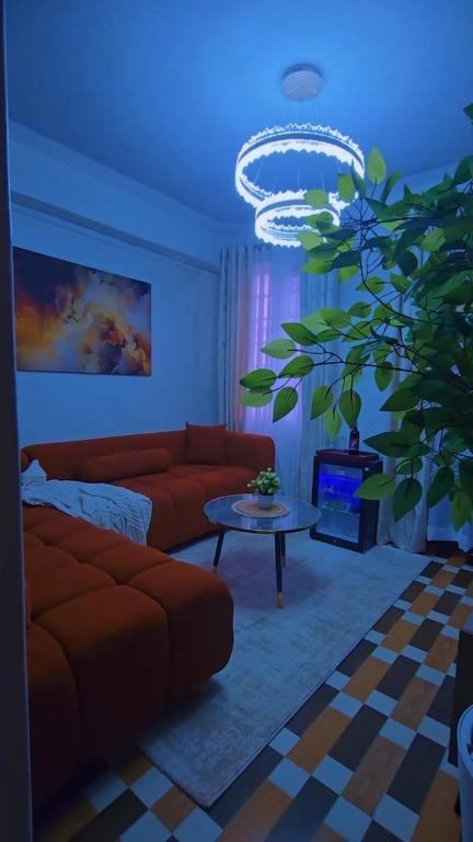 a living room with a couch and a table at CB Luxury in Kisii