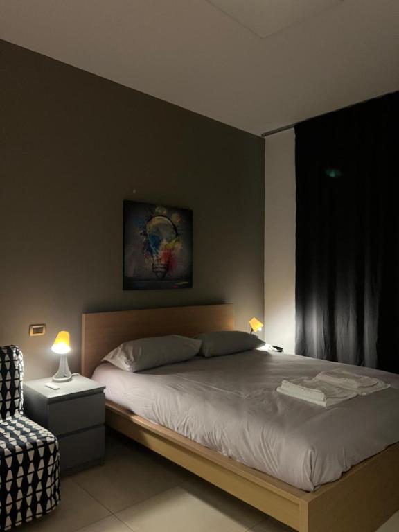 a bedroom with a large bed and a window at LA Tulè 2 in Popoli