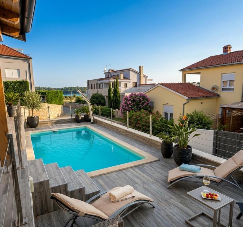 a swimming pool in the backyard of a house at Luxury Histria Apartment with Private Pool Near the Beach in Banjole
