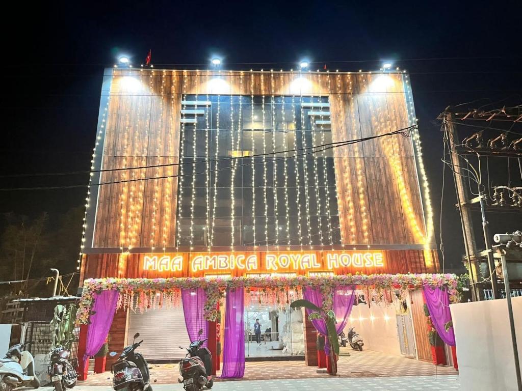 a large building with a royal house at night at Maa Ambika Royal House in Baripāda
