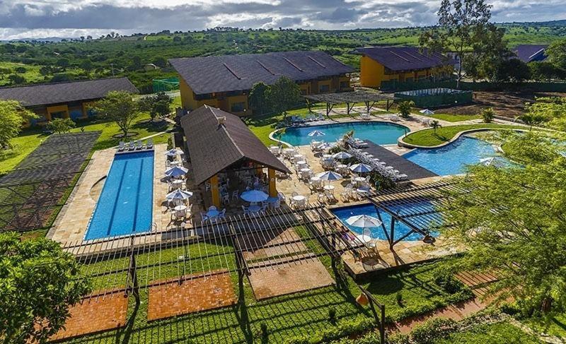 an aerial view of a resort with two swimming pools at Wintterville Apartamento Térreo 13J para até 6 pessoas in Gravatá