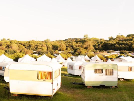 a group of rvs parked in a field at Aparra Surfcamp Auberge Saint-Jean-de-Luz in Saint-Jean-de-Luz