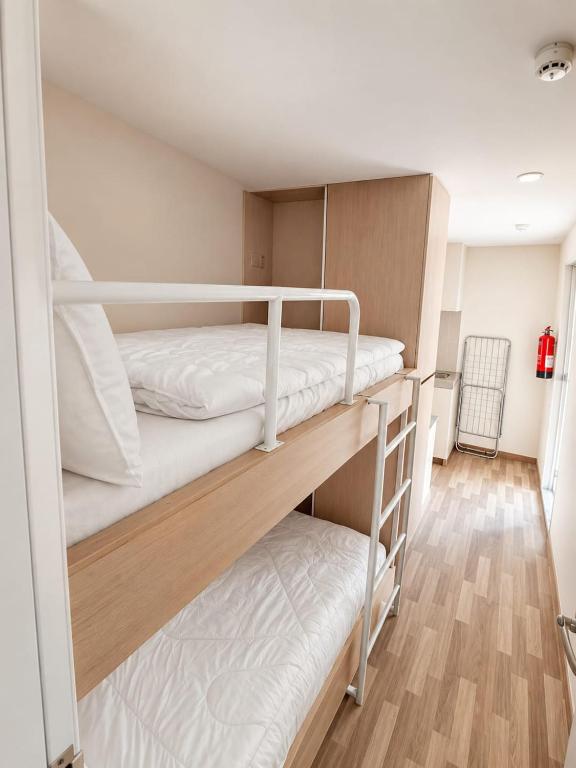 a room with two bunk beds in a room at Smart Private Studio Al Reem Island in Abu Dhabi
