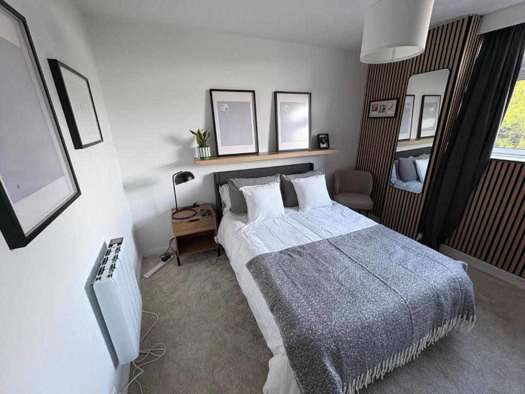 a bedroom with a bed and a tv in it at Ravelston in Edinburgh