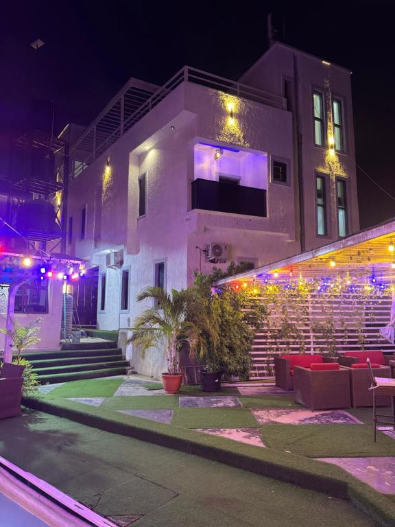 a building with lights in front of it at night at DE Lounge Inn in Ikorodu