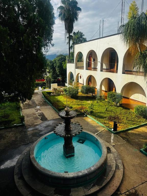 a water fountain in front of a building at Hotel Hacienda de Jalpan in Jalpan de Serra