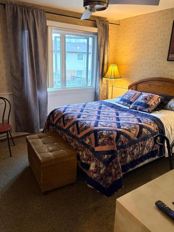 a hotel room with a bed and a window at Comfortable stay in Milton