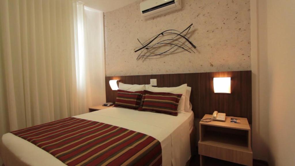 Postel nebo postele na pokoji v ubytování Pampulha Lieu Hotel