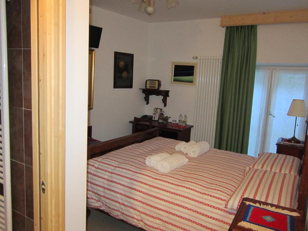 Posteľ alebo postele v izbe v ubytovaní R&B La Gerla Blu