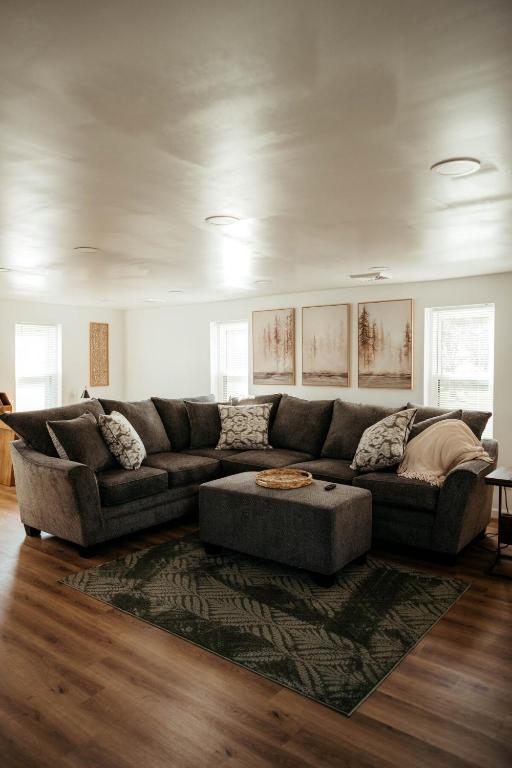 a living room with a couch and a rug at Arminta Street Retreat in DuBois