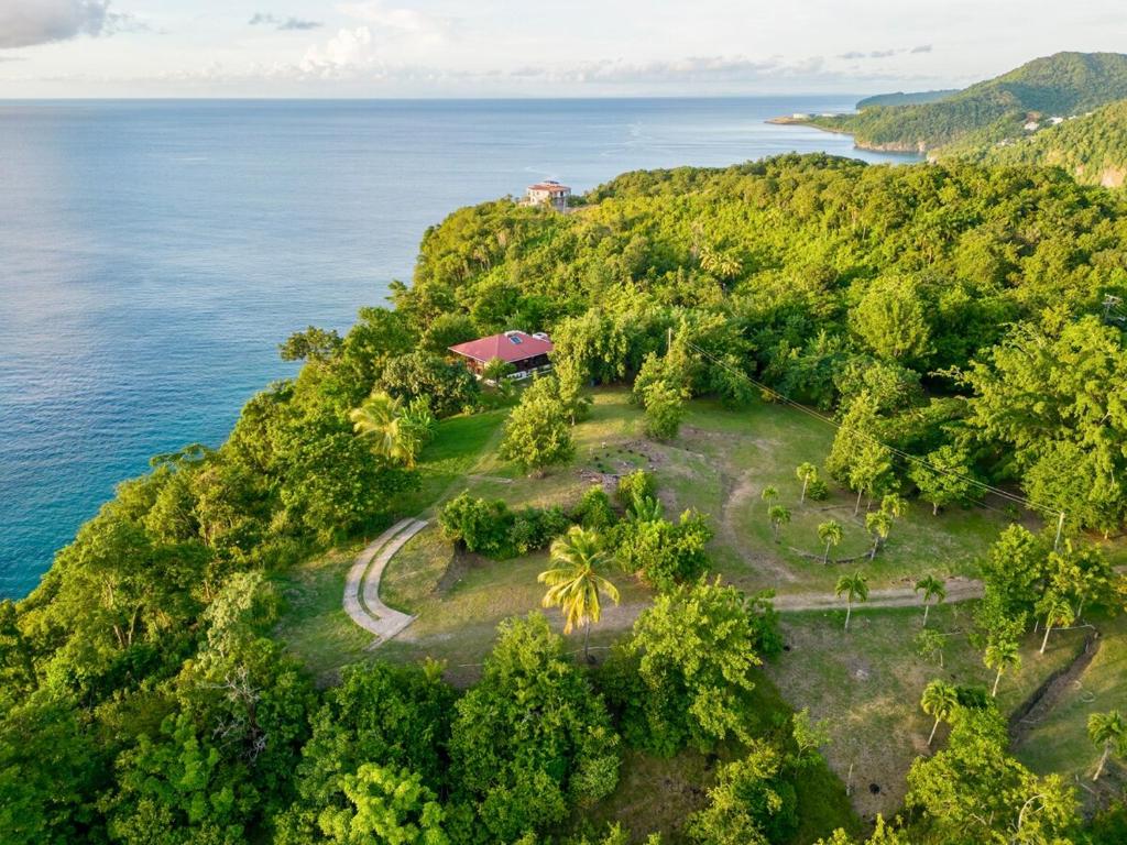 an island in the ocean with a house on it at Annes Retreat in Castries