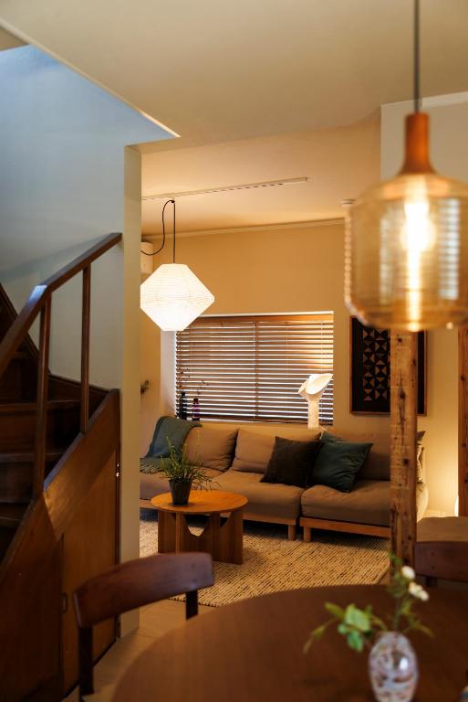 a living room with a couch and a table at kobito in Toyama