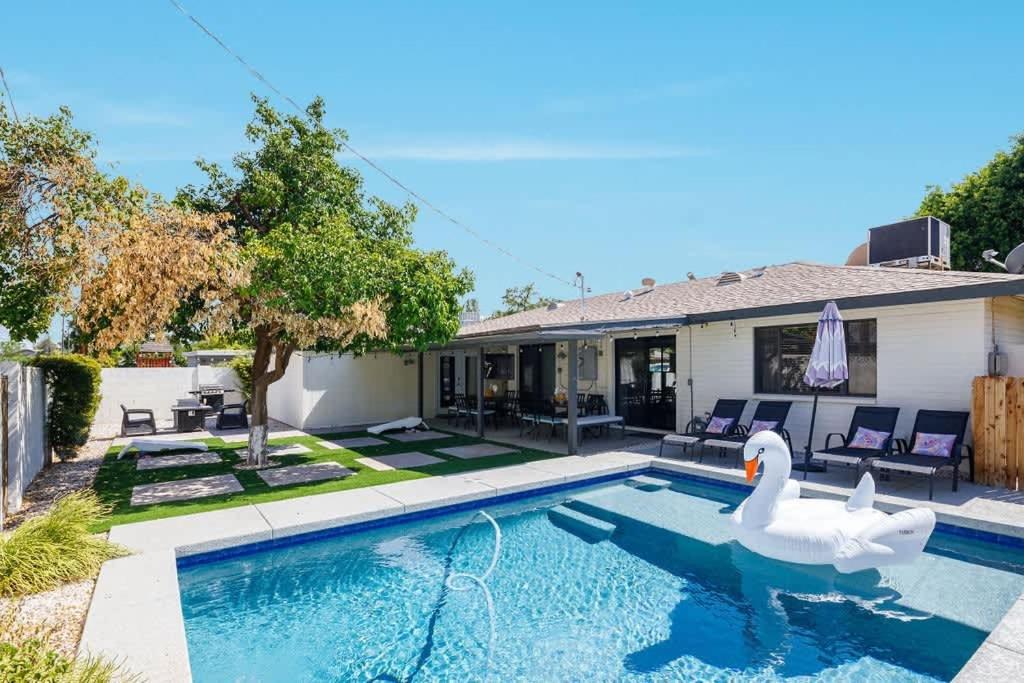 a swimming pool with a swan in a house at Old Town Art Deco - Pool&Fire Pit - In Old Town in Scottsdale