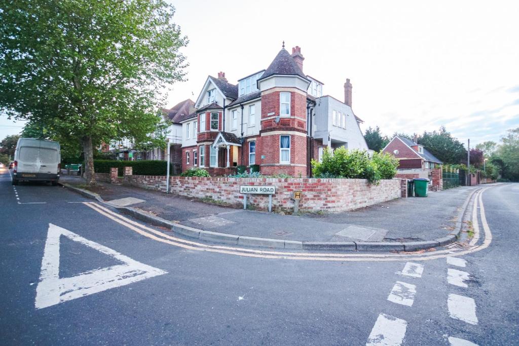 a large red brick house on the side of a street at 8ight Havens - Channel Euro Tunnel - Folkestone in Folkestone