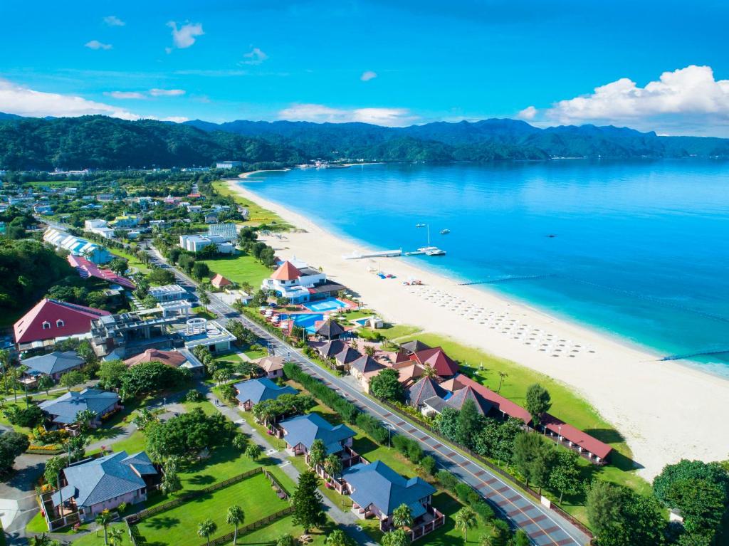 an aerial view of a beach with houses at Okuma Private Beach & Resort in Kunigami