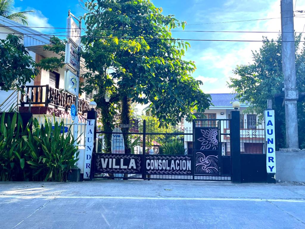 a black gate with the words villa custodian on it at Villa Consolacion Resort in General Luna