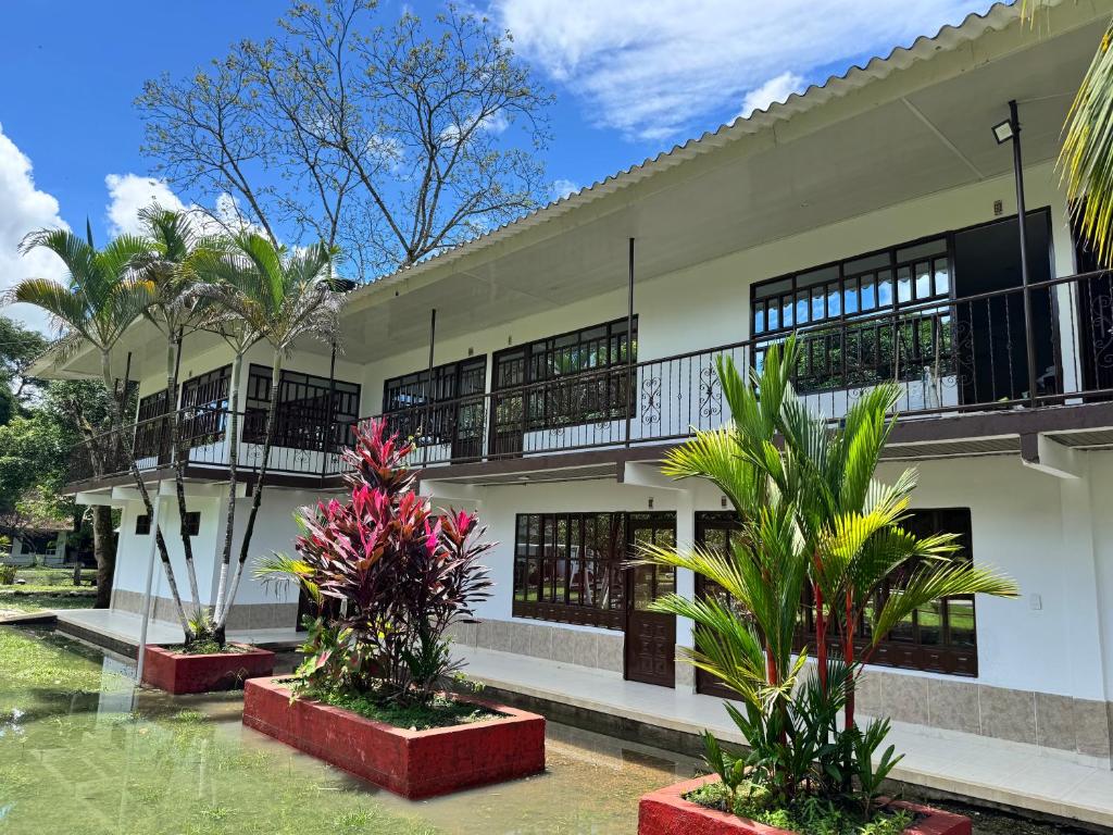 a building with plants in front of it at SERRANTE Hotel Campestre in Villavicencio