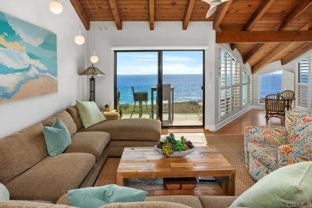 a living room with a couch and a table at Solana Beach Resort in Solana Beach