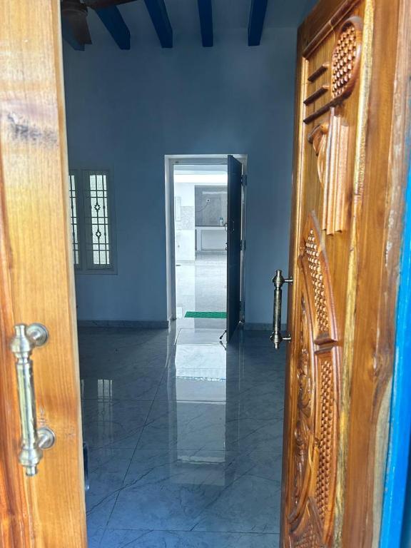 an open door to a room with a hallway at La Maison D&N in Pondicherry