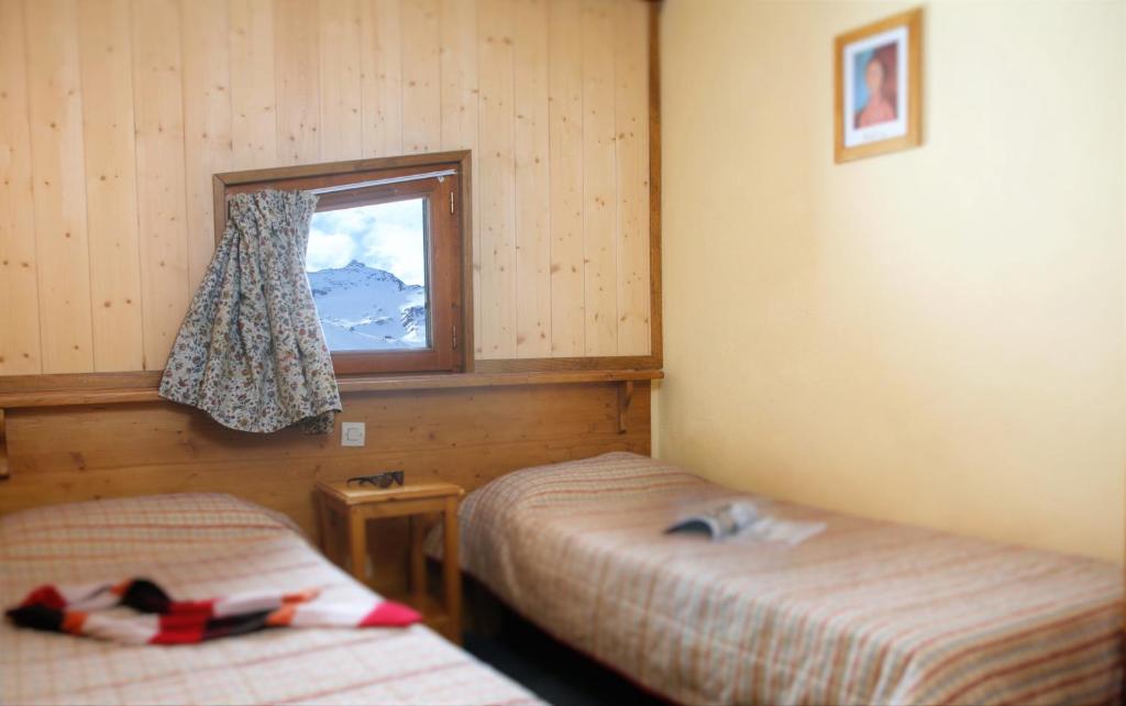 Postel nebo postele na pokoji v ubytování Le Cheval Blanc - Village Montana
